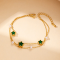 Pulsera dorada de estrella verdes