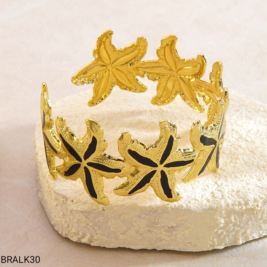 Brazalete Estrellas de Mar Esmalte Negro Dorado