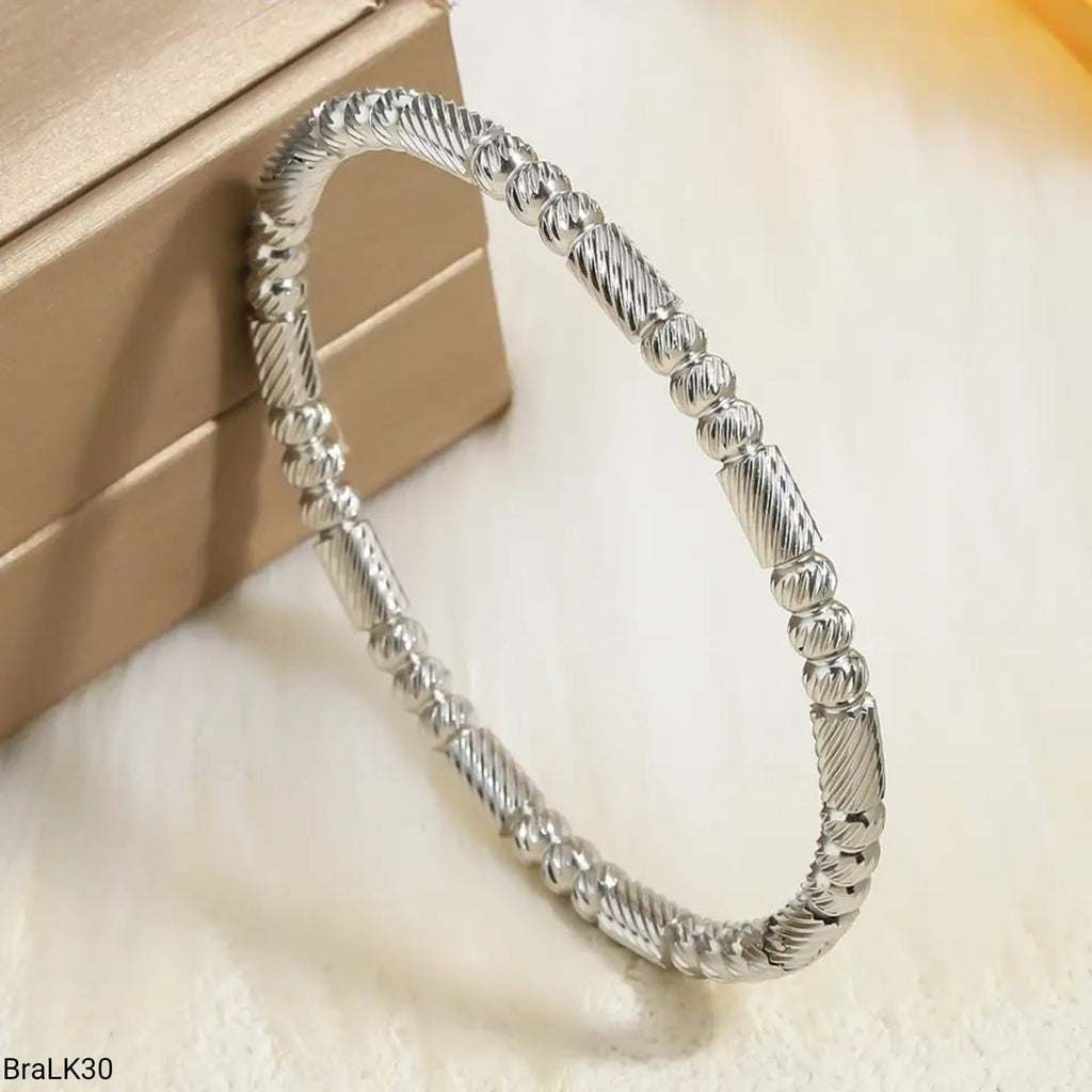Pulsera Rígida Espiral Baguette Plateada