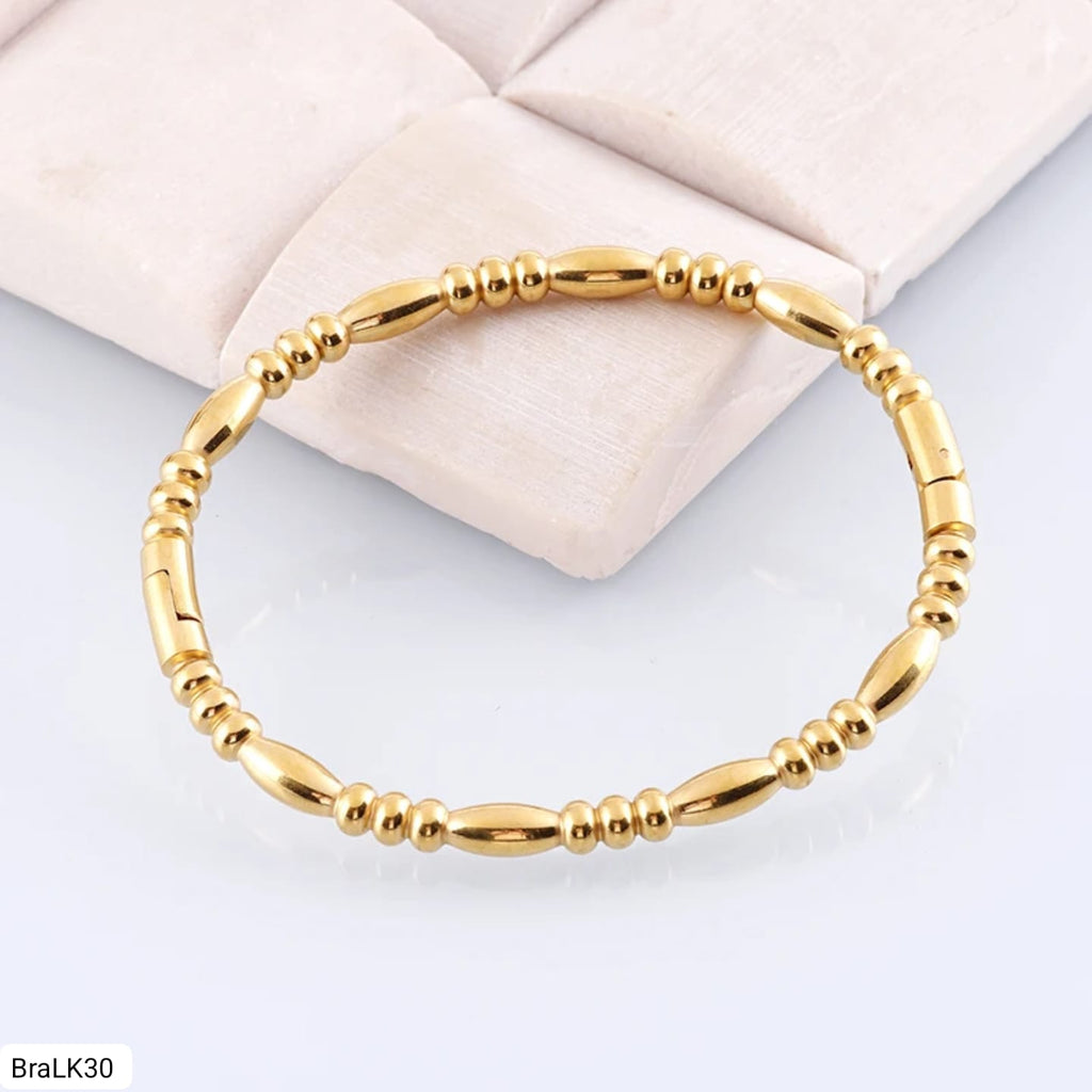 Pulsera Óvalos y Discos Dorada