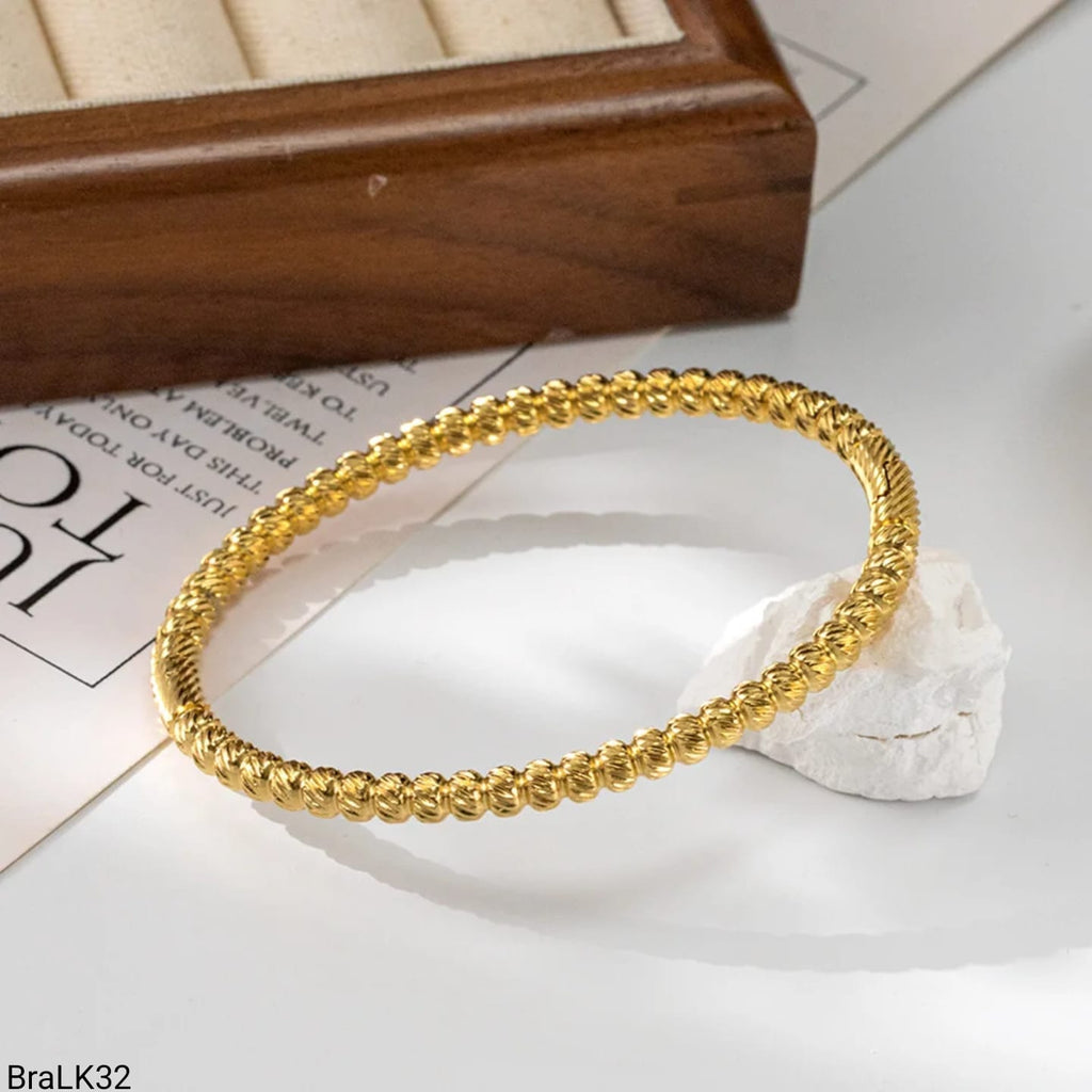 Pulsera Rígida Bolas Texturizadas Dorada