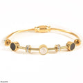 Brazalete Rígido Medallones Nácar y Ónix Dorado