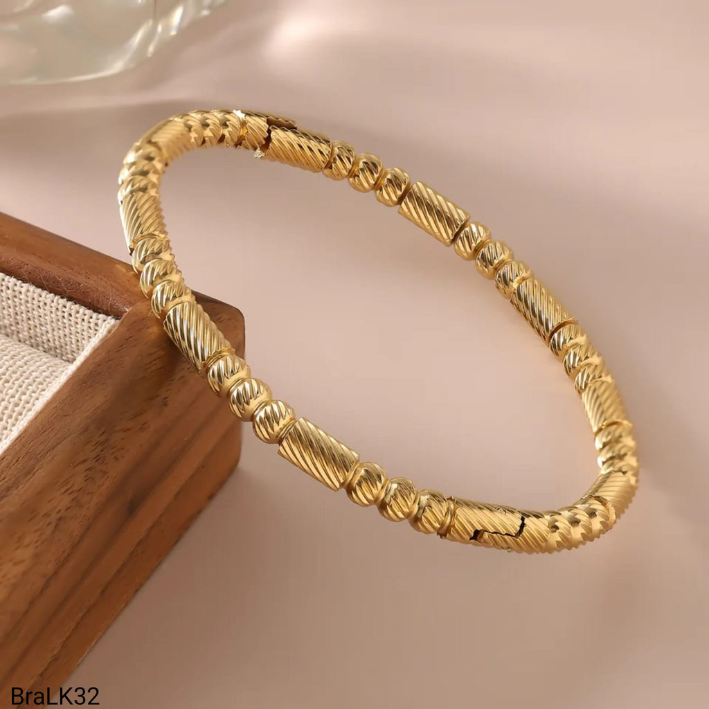 Brazalete Rígido Bolas Texturizadas Espiral Dorado